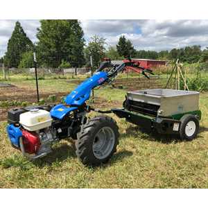 Spreader attached to Model 749 with optional 22" Wheel Extensions for straddling raised beds.